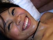 Sweet and sexy young Asian woman is so happy and smiles and laughs as white man cums all over her pretty face
